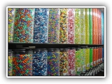 Candy Wall - The candy wall is a main attraction at any type of event. Set ups offer ten different candy choices - all well known brands such as m&m's, candy corns, Gummie Bears and more�Ķ.. Kids get a small bag to fill with a variety of their favorite treats and take home as a party favor.