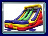 Double Slide - The impressive Double Lane slide is a dual dry slide guaranteed to add tons of excitement and acceleration to any indoor or outdoor event. Great for friendly competition or group challenges, kids can climb together up the center climb, and then choose a left- or right-sided slick slide, for a fast-track ride to the cushioned bottom with a safety stop. Hooded safety on top makes sure riders slide down properly.