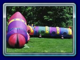 Cameron The Caterpillar - This multicolored giant caterpillar features 55 feet of travel through adventure. Children enter the mouth, crawl through his giant teeth and other internal obstacles, finally reaching the mini slide before exiting the tail.