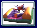 Pillow Bash - Climb up onto the pole and attempt to knock off your opponent with a swing of your pillow. This inflatable measures approx 15' x 15'.