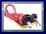 Swamper - Ready... Set... Go!  Dive into one of the huge tires as you and your opponent scramble through six different challenges!  Scramble through the inflatable stand-ups, bust through the inflatable logs, squeeze through the log squeeze, scale the rock wall, and slide down to the finish.